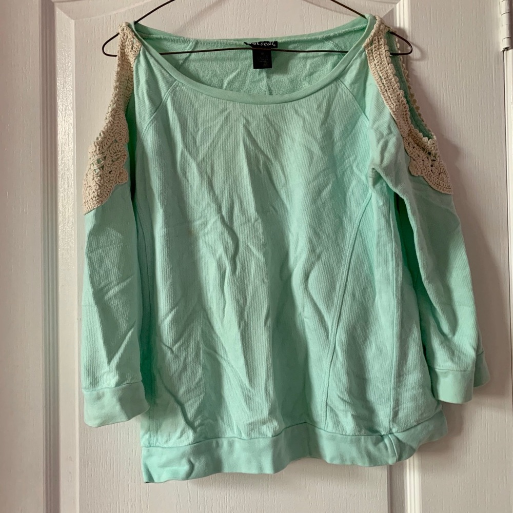 Blue long sleeve with shoulder slit.